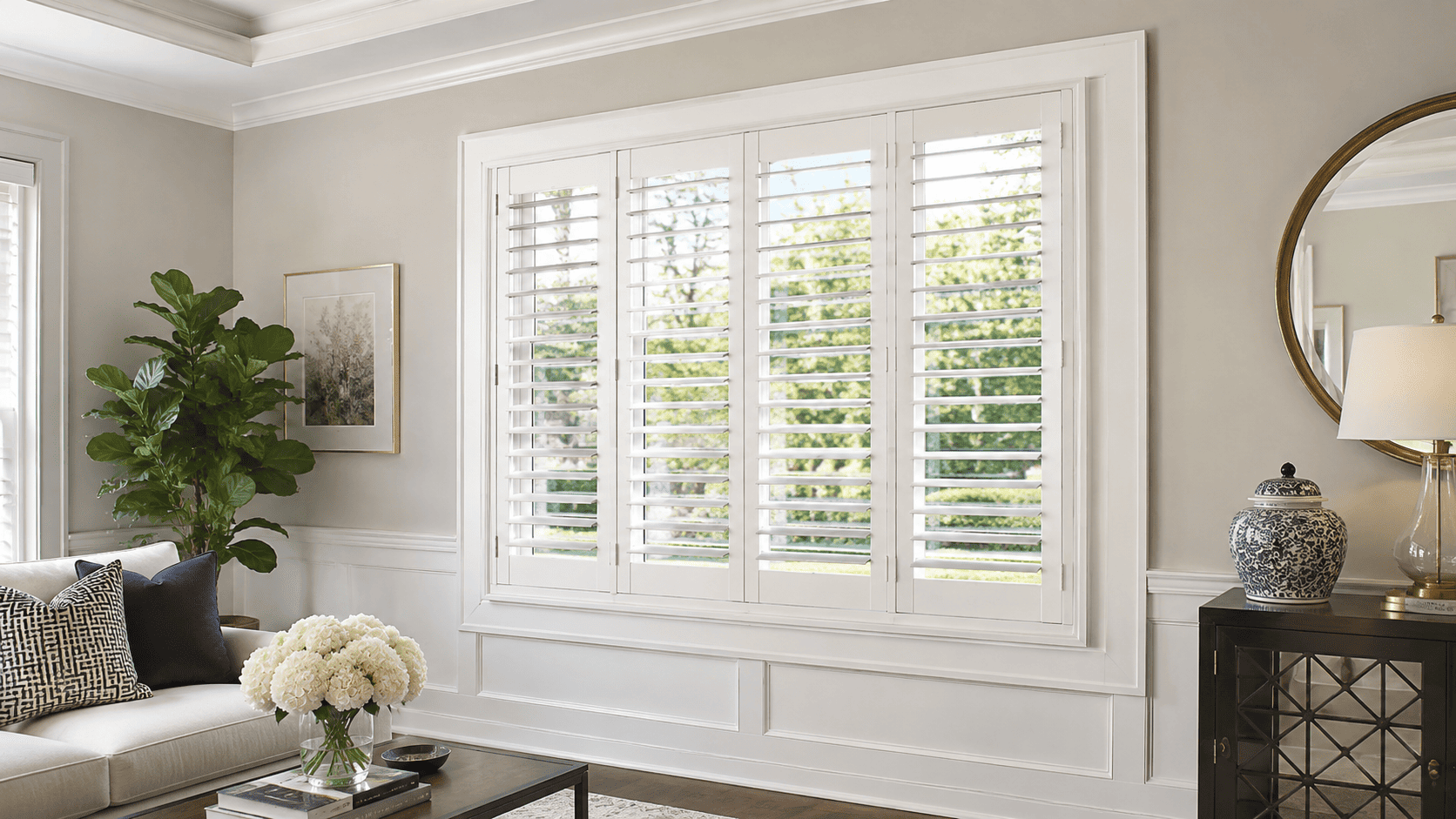 Outside mount shutters in bright living room