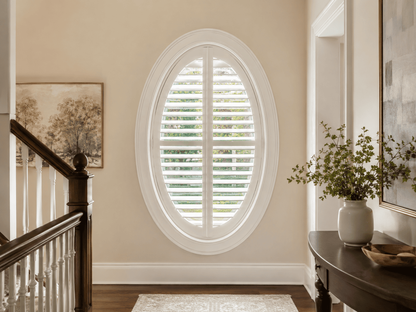 Oval window shutters in elegant hallway
