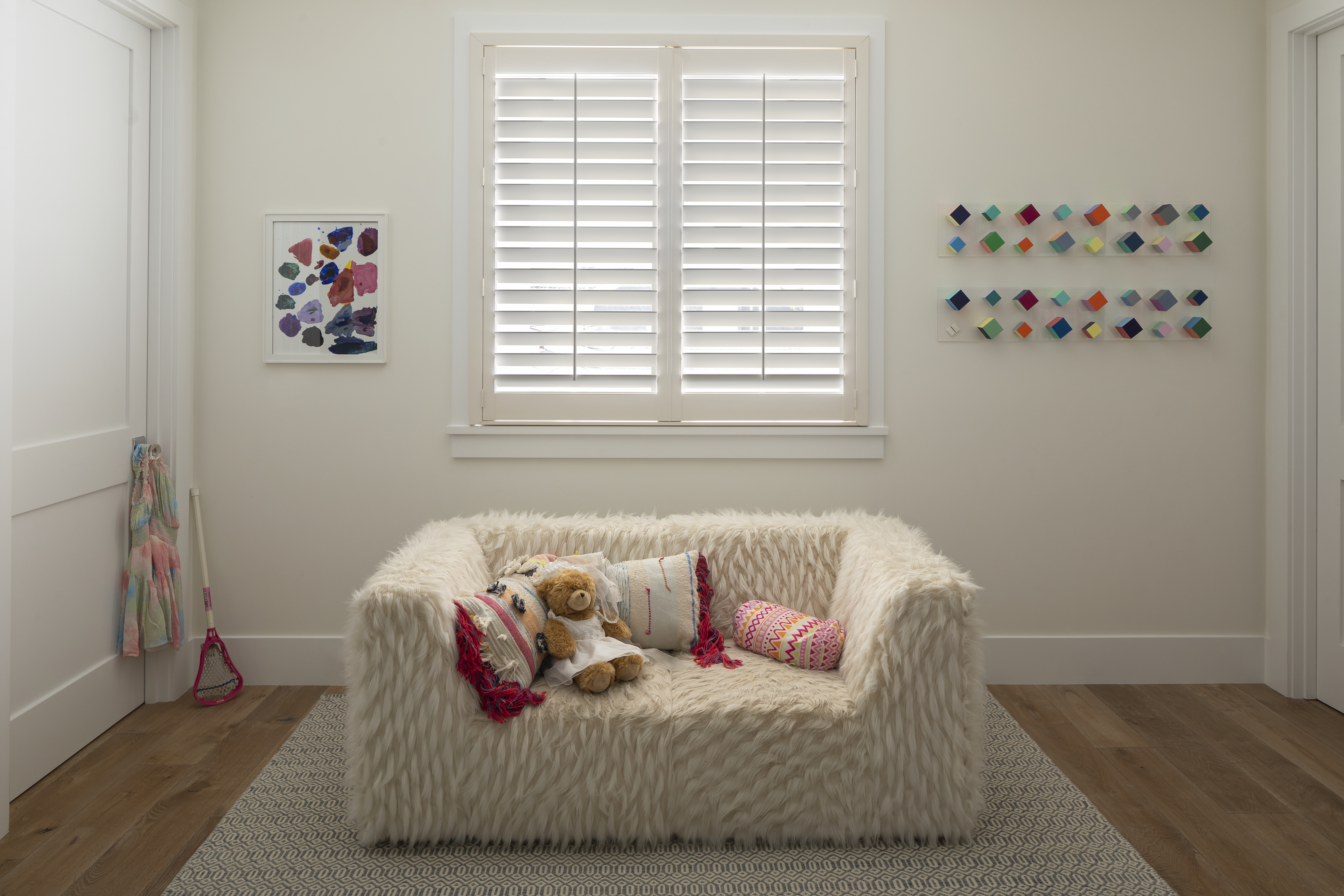 Outside mount shutters in bright living room